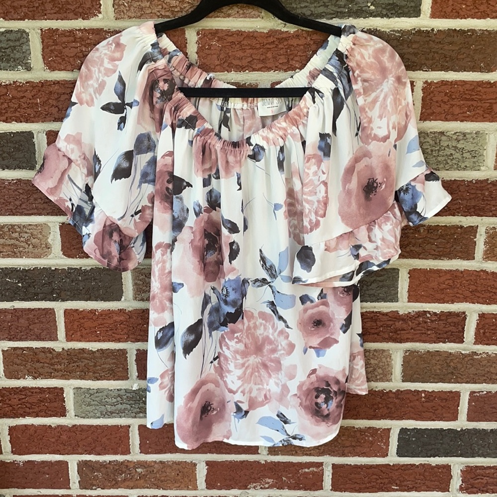 Off the shoulders floral top with ruffles on the arms. Size is a small. - Picture 1 of 2